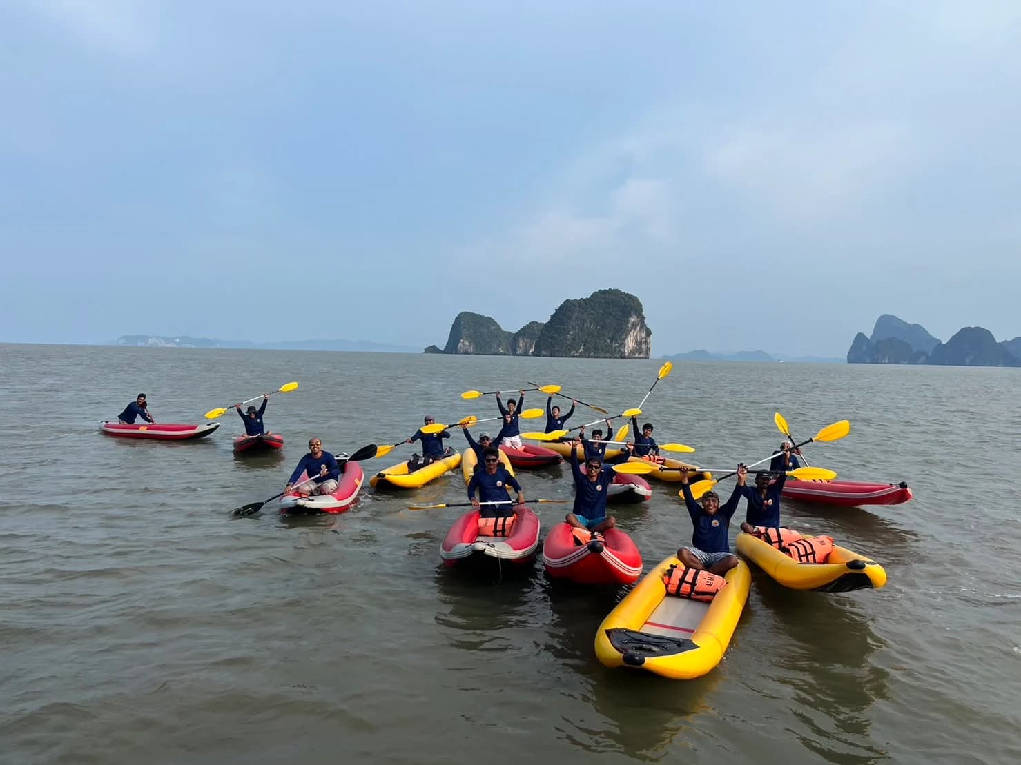 A group of guided canoes gathered on the bay